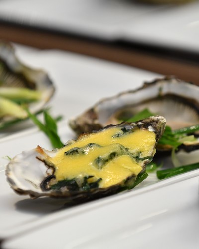 Baked oysters with baby spinach and hollandaise sauce with Chablis Grand Cru